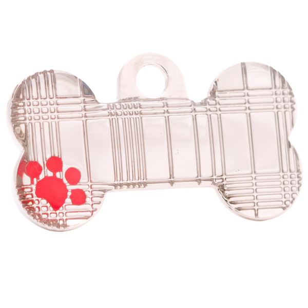 Hamish McBeth stylish tartan bone shaped pet id tag with a red hand enameled paw detail. Custom designed, durable and unique. Thick, heavy duty metal, rustproof, split ring included and free engraving. Available in gold or silver. Size: 4 x 2.1cm