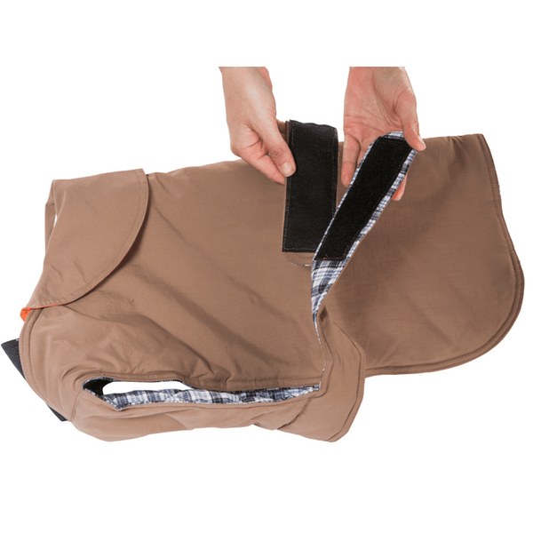 Hamish McBeth earth brown all-weather dog coat is windproof and water-resistant with orange highlights is an outdoor gear essential. The unique design of our dog coat allows it to wrap around the chest area to cover and provide extra protection. Easy to fit with velcro straps on top. and is fully quilted for extra warmth. Available in 6 sizes for small  to large dogs.