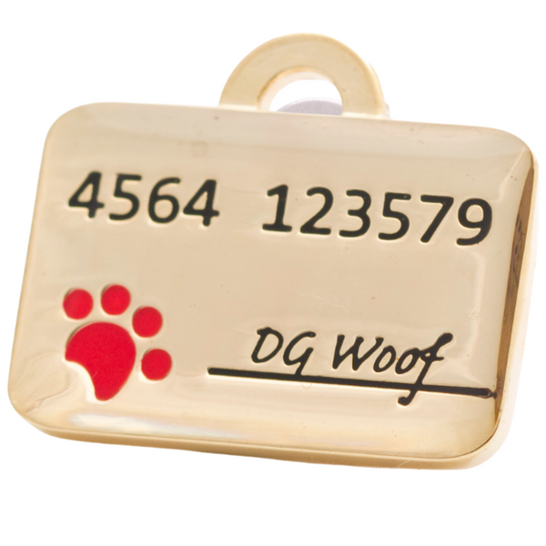 Hamish McBeth credit card pet ID tag with hand enamel detail including a cute red paw stamp. Customer designed durable tag. Rustproof, thick, heavy duty metal with thick protective coating. Free laser engraving with a polished mirror finish. Split ring included. Available in gold or silver. Size: 3 x 2cm