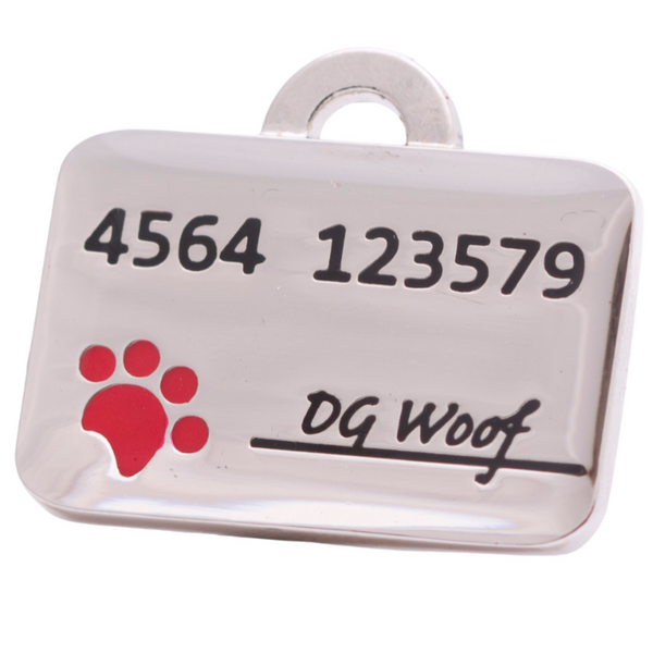Hamish McBeth credit card pet ID tag with hand enamel detail including a cute red paw stamp. Customer designed durable tag. Rustproof, thick, heavy duty metal with thick protective coating. Free laser engraving with a polished mirror finish. Split ring included. Available in gold or silver. Size: 3 x 2cm