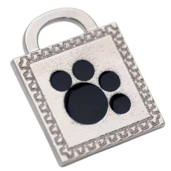 Hamish McBeth paw pet ID tag with black enamel paw detail. Custom designed, durable, rustproof, heavy duty metal with a protective coating. Free engraving with a polished mirror finish and split ring included. Available in gold or silver. Size: 2.5 x 2.5cm